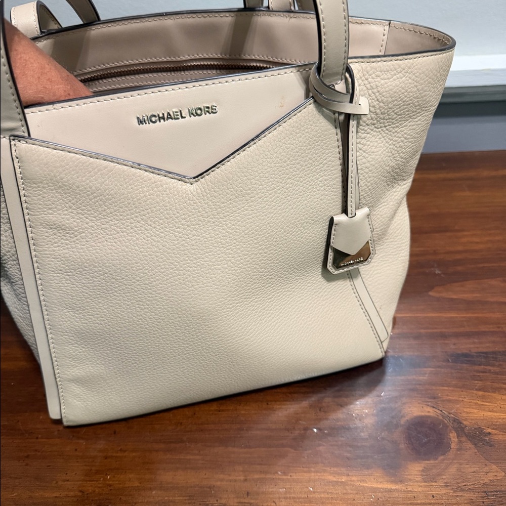 Beige medium sized Michael Kors handbag